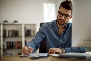 Man writing - Istock