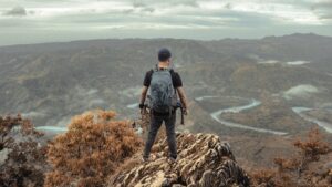 Student looking over the world below