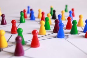 Colorful toy cones with lines connecting to each other to imply a networking aspect