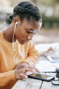 Student browsing phone for focus apps