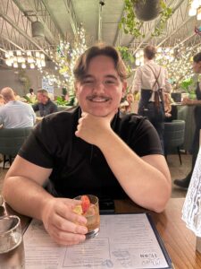 Samuel Ramirez holding a drink.