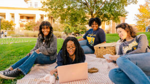 A group of students hanging out after finding the right college for them.