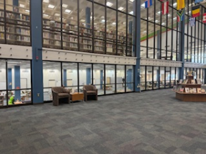 The inside of the library displaying history, resting spot, and hundreds of books. It is on the second floor. 