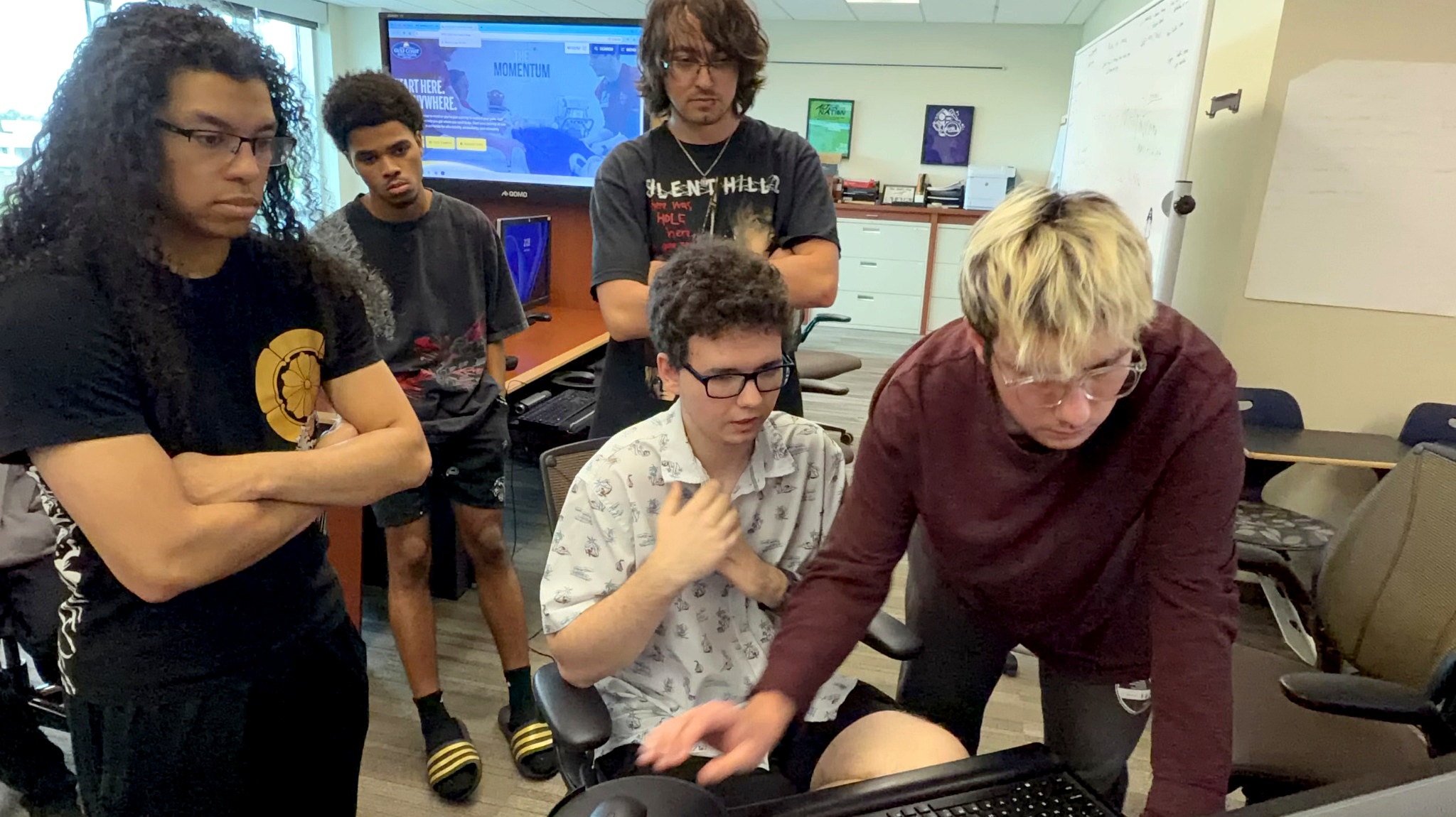 Weekday Blues making final edits while Robert Koss assists teammates